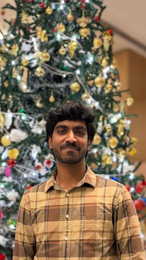 Standing in front of a decorated Christmas tree