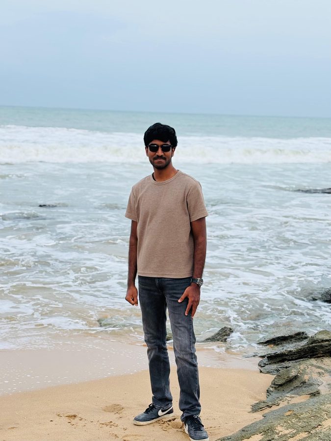 Standing at the shoreline on a beach